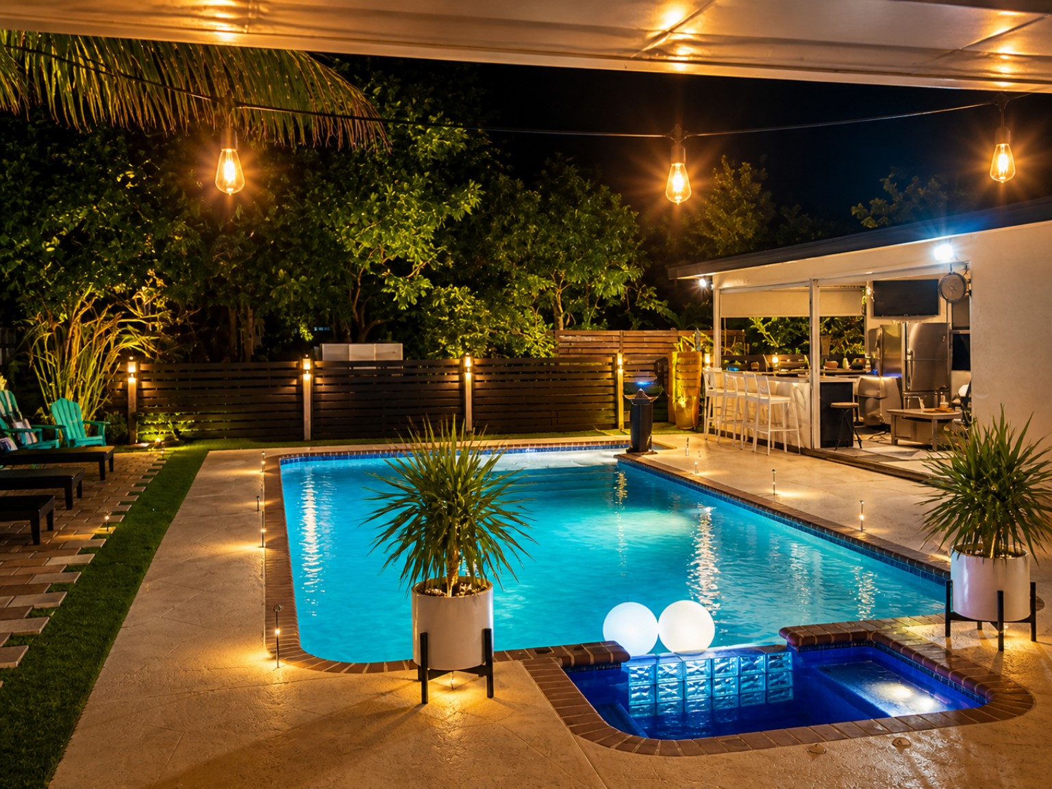 Illuminated swimming pool and outdoor lounge